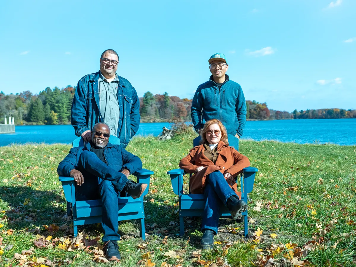 The four Accents co-founders together by a lake