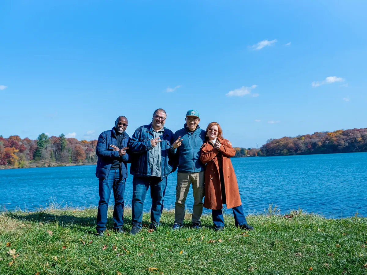 The four Accents co-founders by the lake, smiling